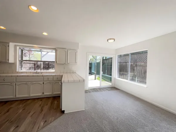 a room with window and cabinet