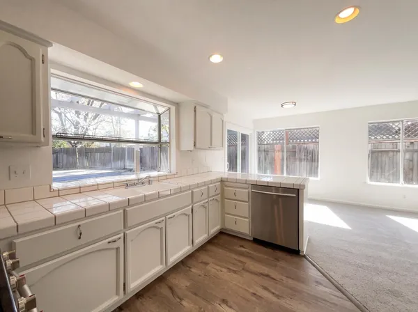 a kitchen with sink and window