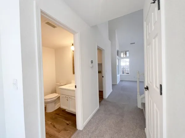 a bathroom with a granite countertop toilet sink and a shower