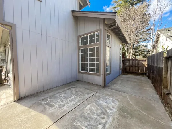 a view of a house with a backyard