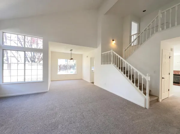 a view of an empty room with windows