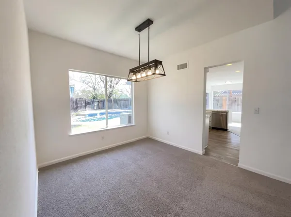 a view of a room with window cabinet and stairs