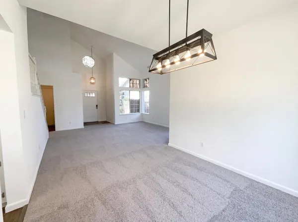 a view of a room with a ceiling fan