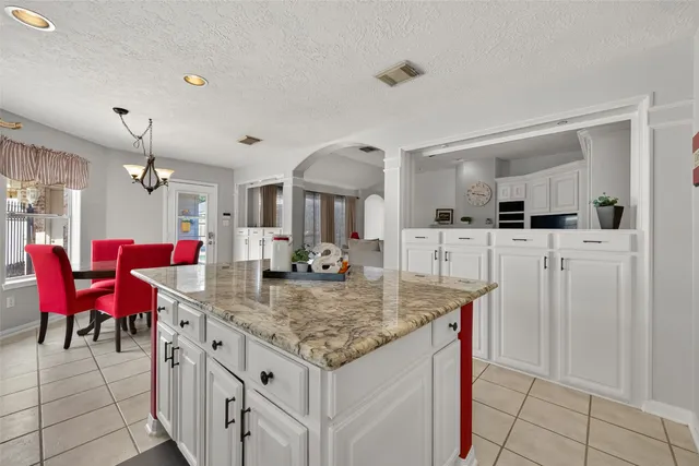 a view of a kitchen and dining table