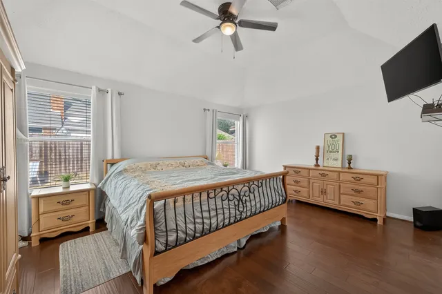 a bed room with a bed and a window