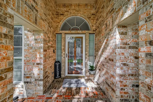 a front view of a house with large windows