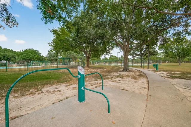 a view of a park with large trees