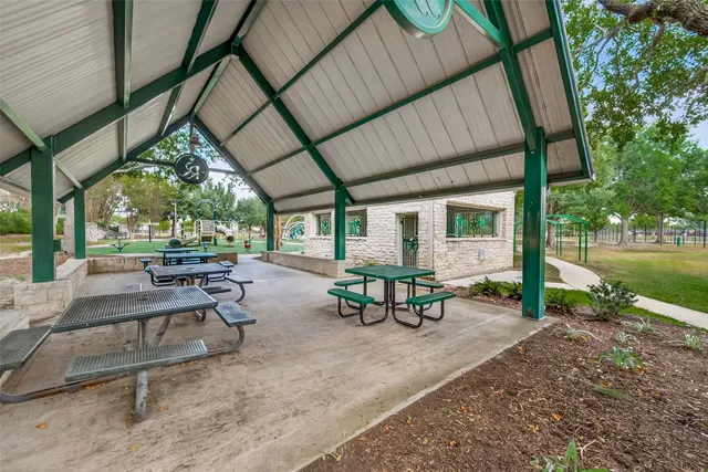 a view of a park with large trees