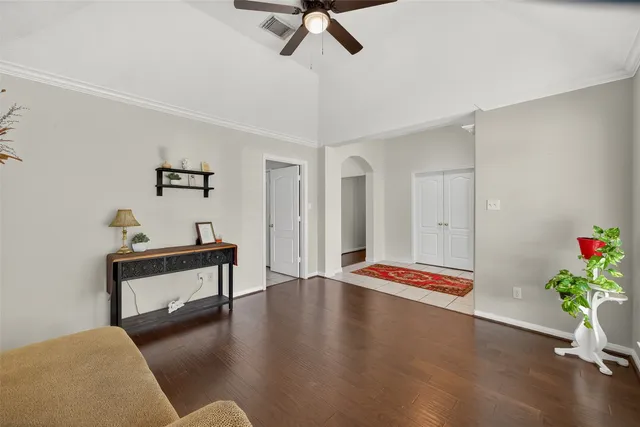 a living room with furniture and a potted plant