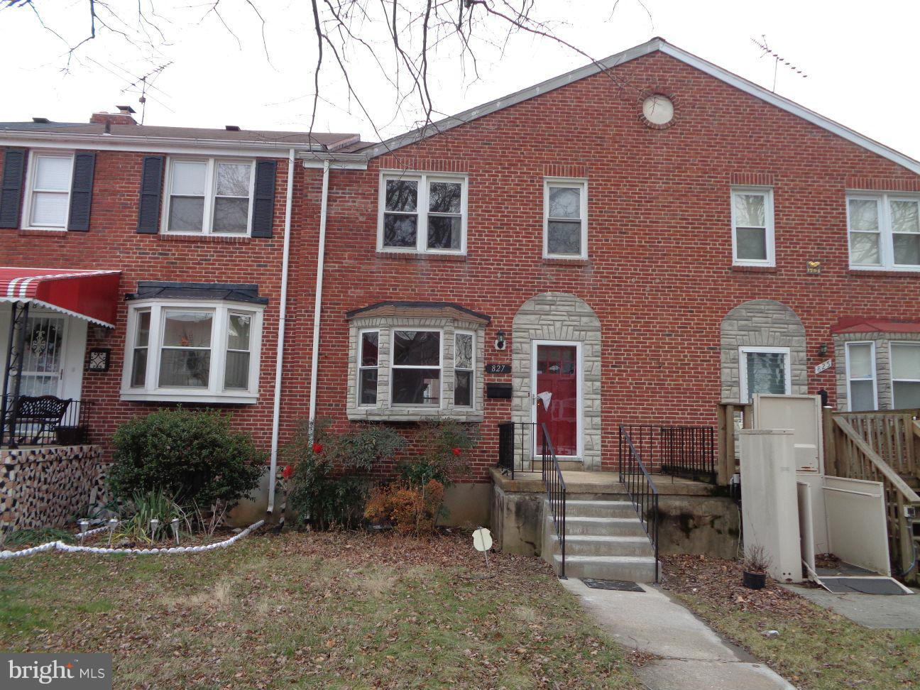827 Wedgewood Road Baltimore, MD 21229 - Photo 1 of 22 a front view of a house with a yard