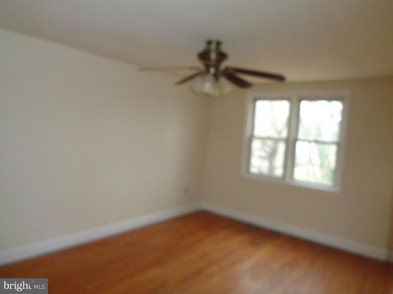 827 Wedgewood Road Baltimore, MD 21229 - Photo 14 of 22 an empty room with a window