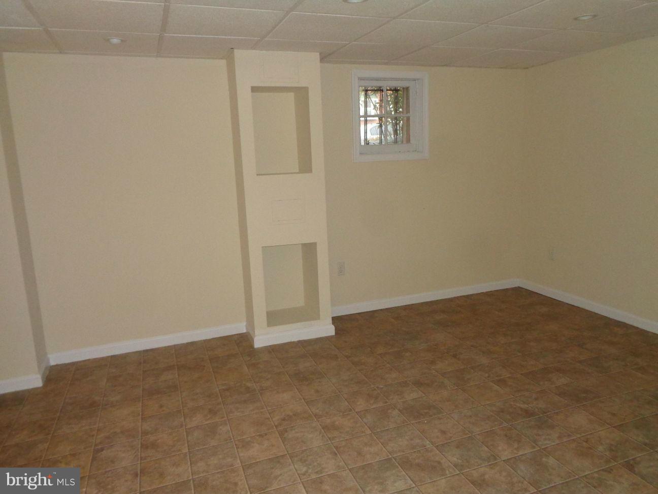 827 Wedgewood Road Baltimore, MD 21229 - Photo 19 of 22 an empty room with windows