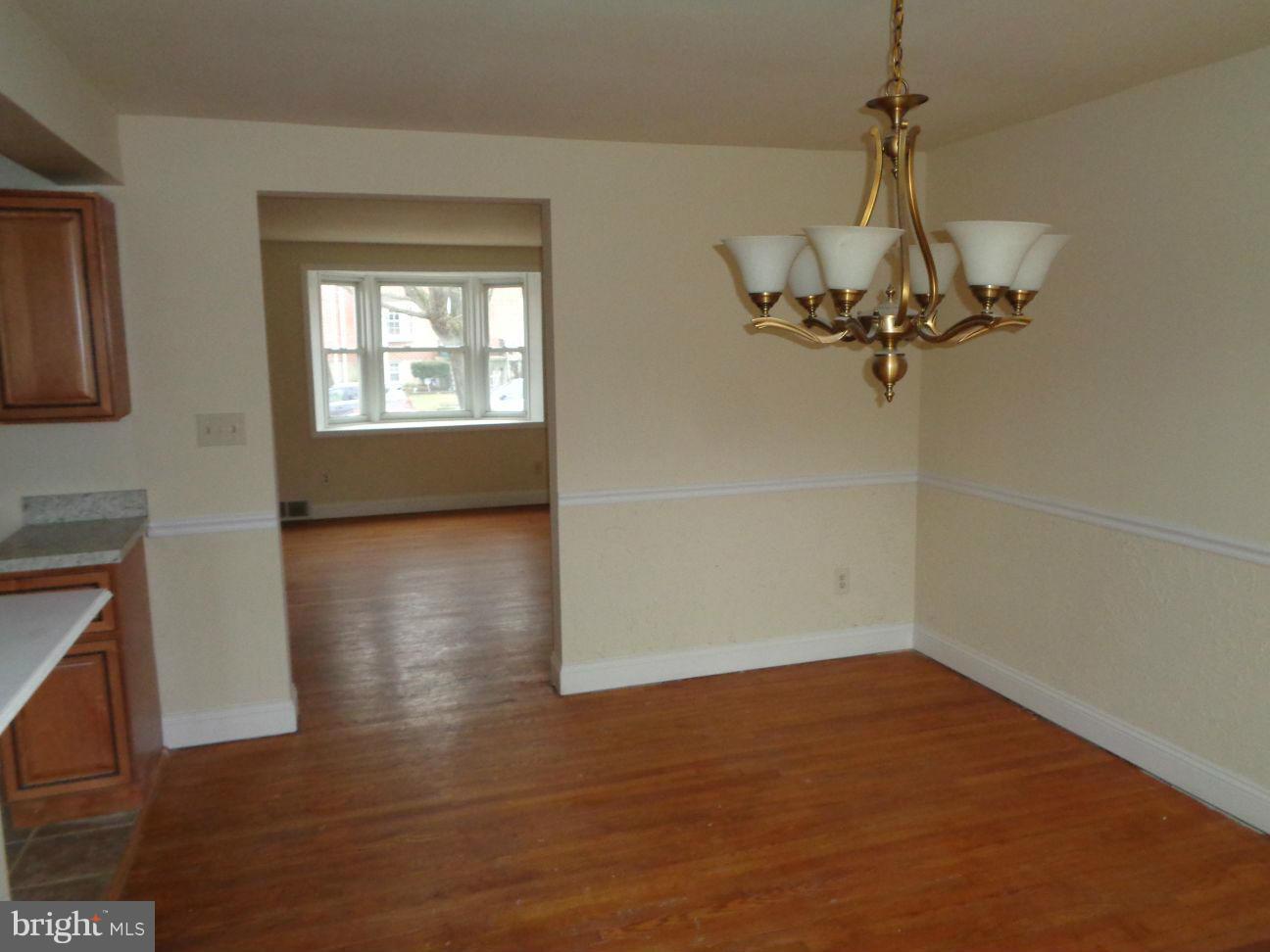 827 Wedgewood Road Baltimore, MD 21229 - Photo 8 of 22 a view of a room with wooden floor closet and windows