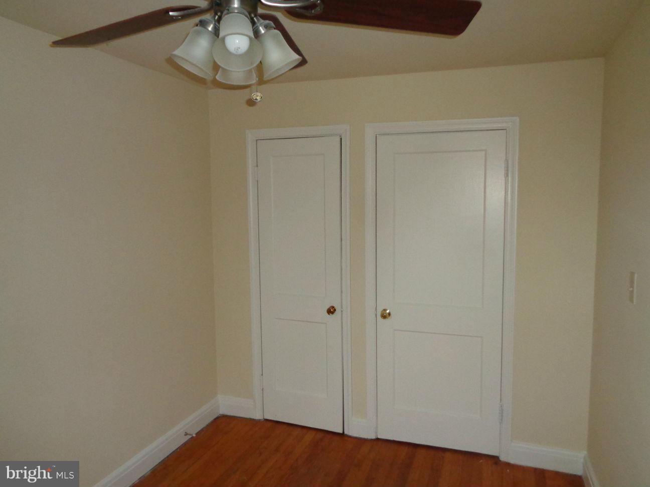 827 Wedgewood Road Baltimore, MD 21229 - Photo 10 of 22 a view of a room with a hanging light and carpet