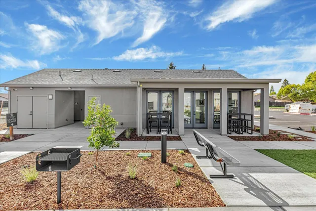 a front view of a house with garden