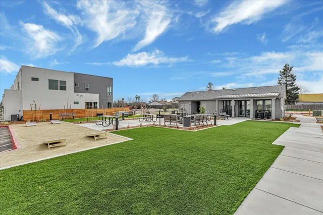 a view of a house with a yard porch and sitting area