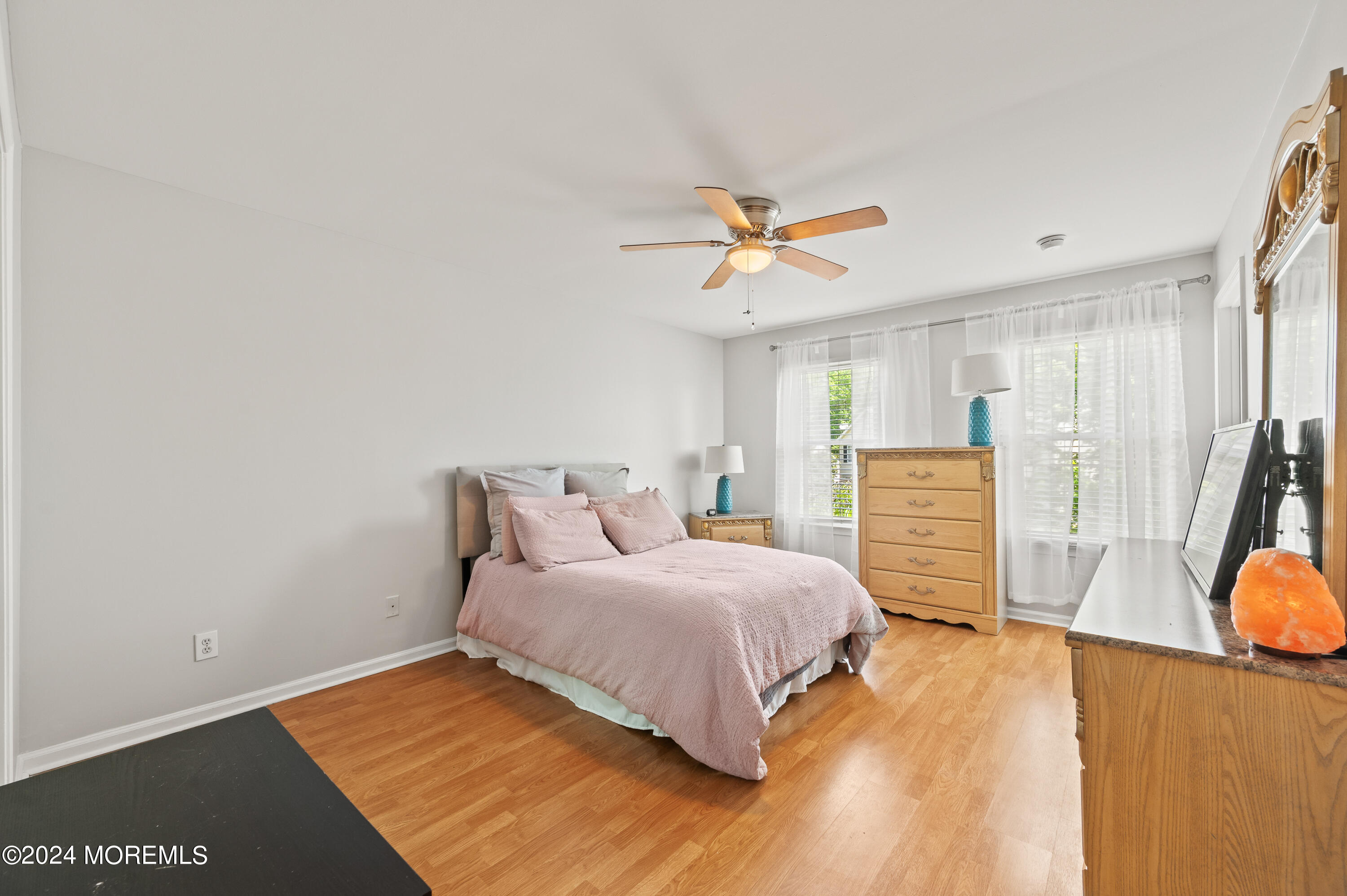 52 Danella Way Howell, NJ 07731 - Photo 24 of 42 a bedroom with a bed chandelier and a window
