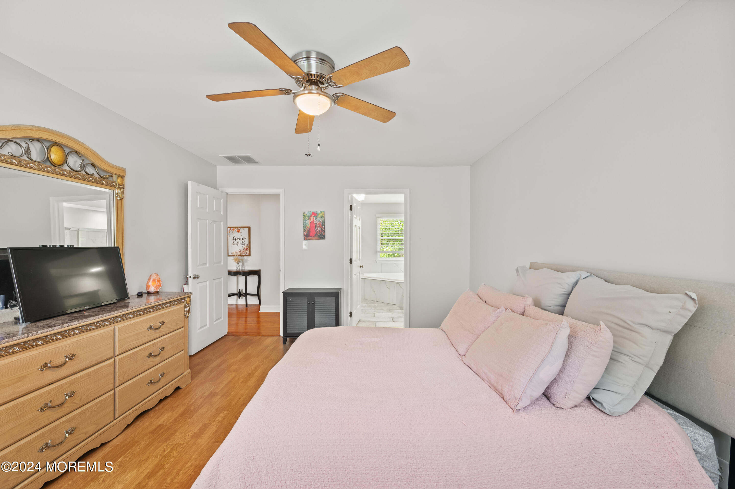 52 Danella Way Howell, NJ 07731 - Photo 25 of 42 a bedroom with a bed and a flat screen tv