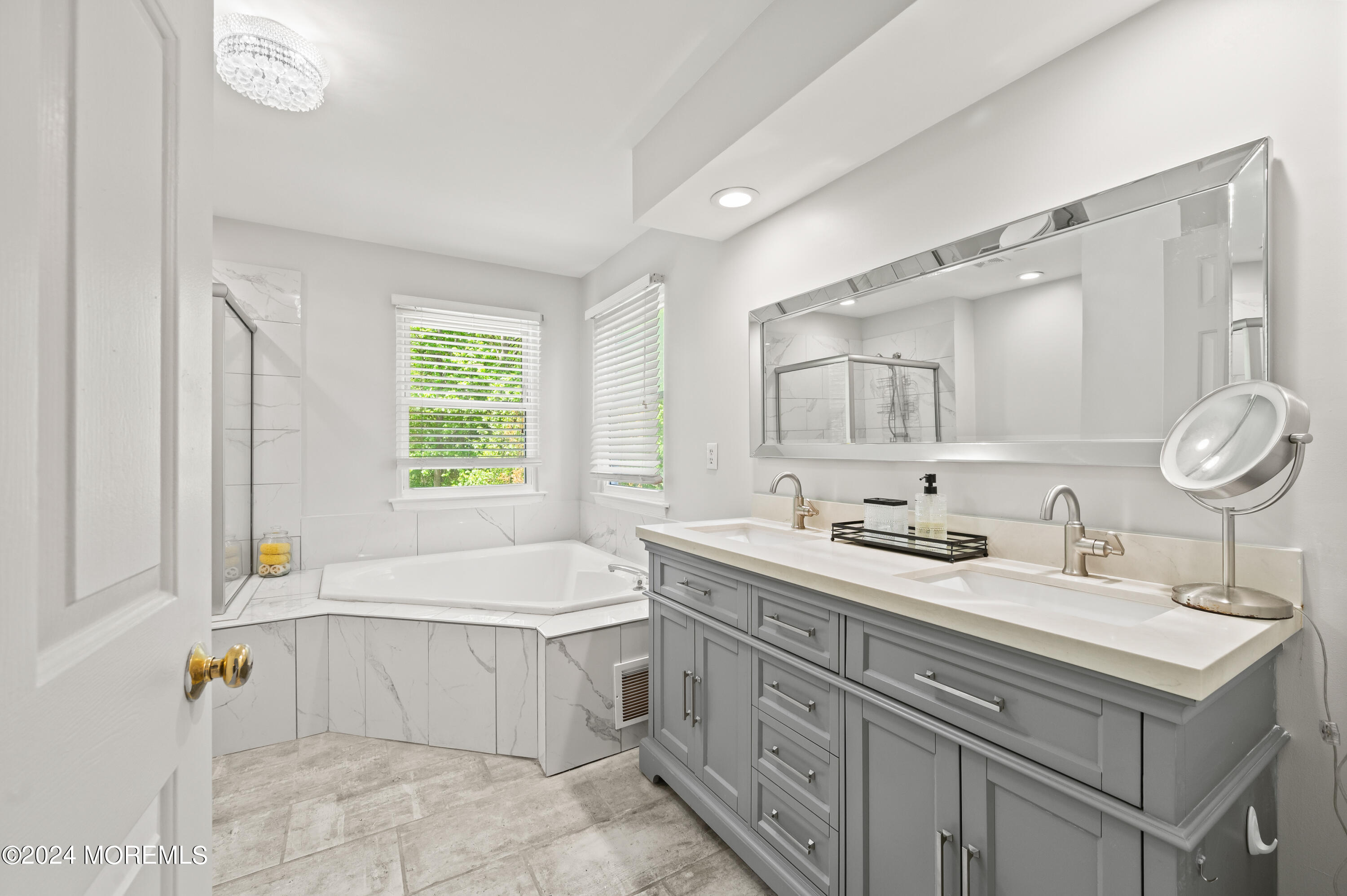 52 Danella Way Howell, NJ 07731 - Photo 26 of 42 a bathroom with a sink double vanity mirror and a bathtub