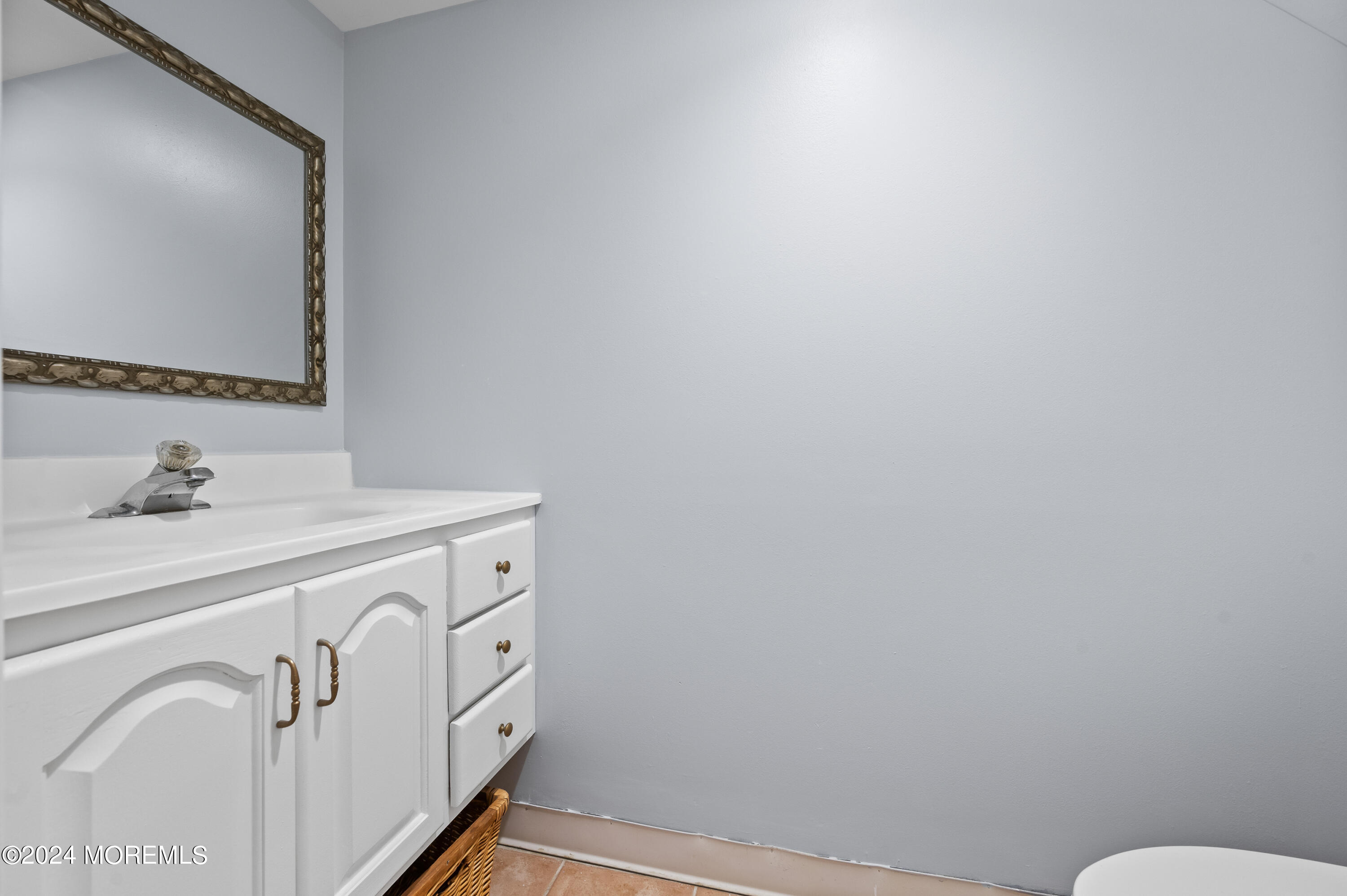 52 Danella Way Howell, NJ 07731 - Photo 31 of 42 a bathroom with a sink and a mirror
