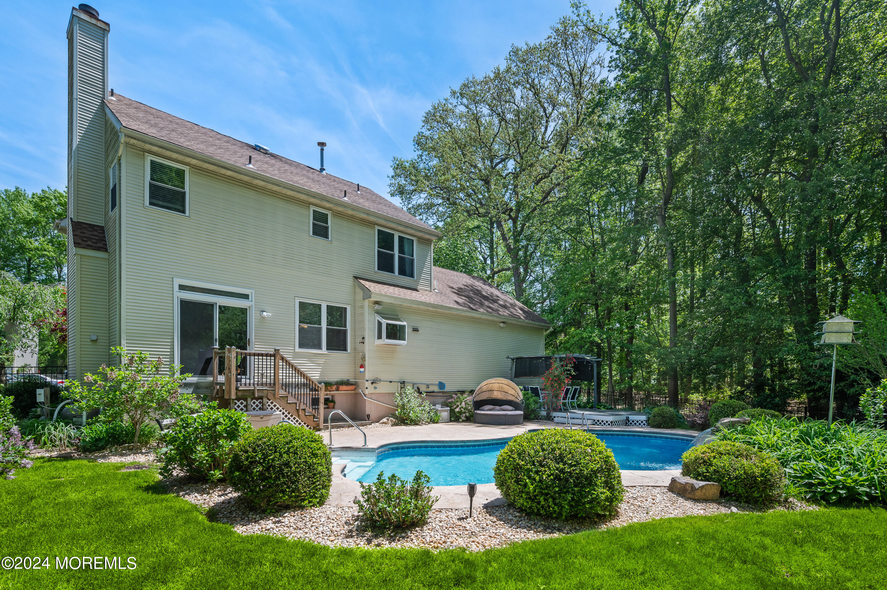 52 Danella Way Howell, NJ 07731 - Photo 38 of 42 a front view of house with yard and outdoor seating
