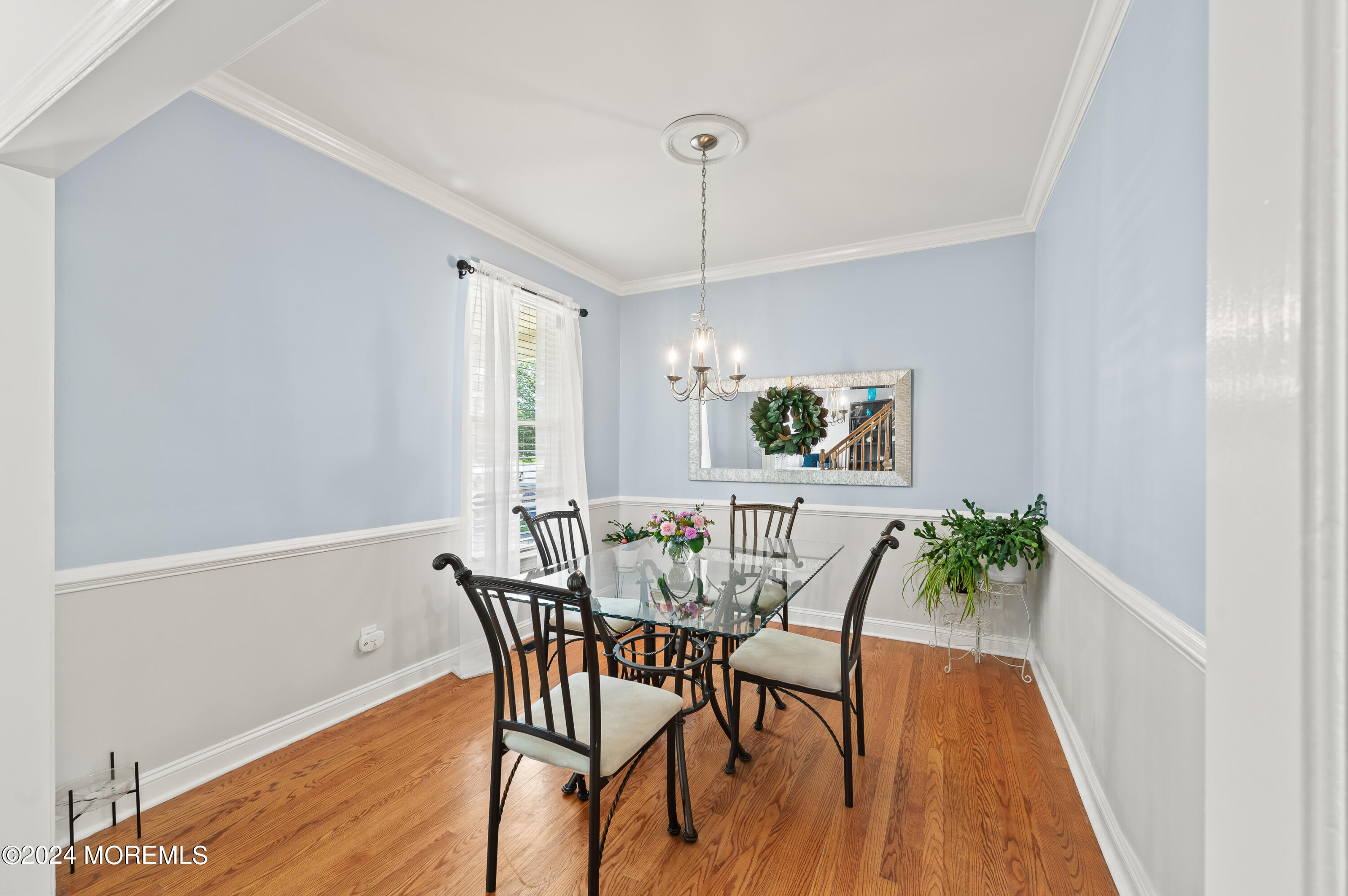 52 Danella Way Howell, NJ 07731 - Photo 9 of 42 a view of a dining room with furniture window and wooden floor