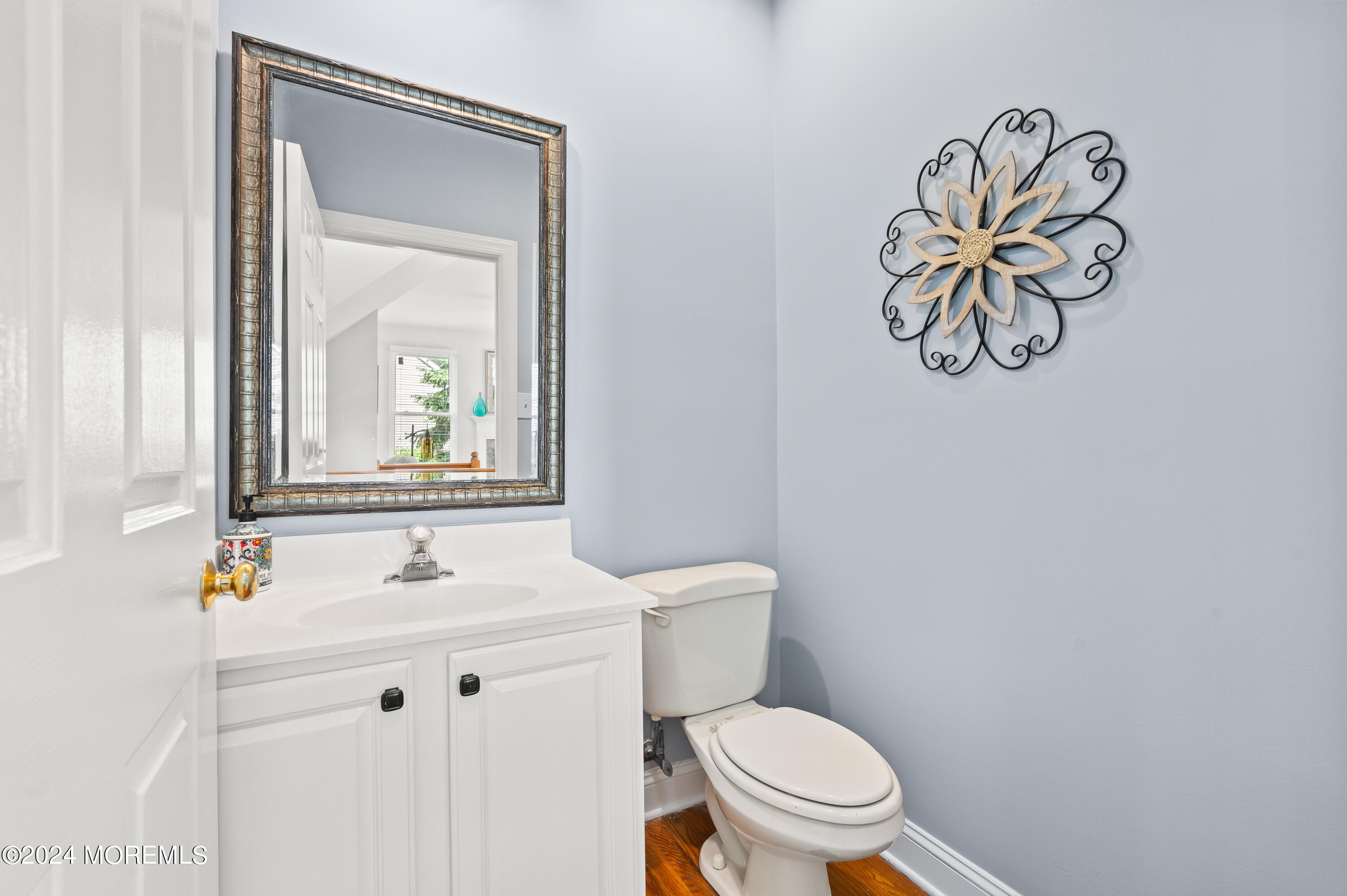 52 Danella Way Howell, NJ 07731 - Photo 10 of 42 a bathroom with a toilet sink vanity and mirror