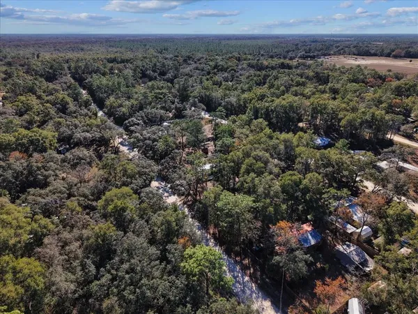 an aerial view of residential house and green space