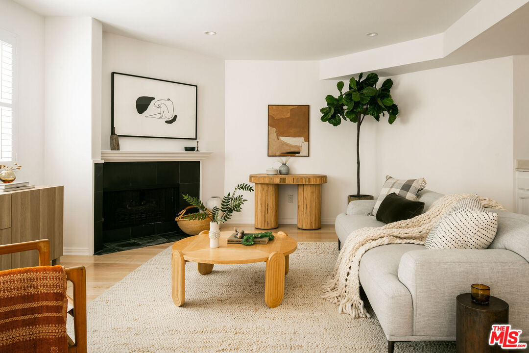 1014 9th Street, Unit 4 Santa Monica, CA 90403 - Photo 12 of 38 a living room with furniture and a fireplace