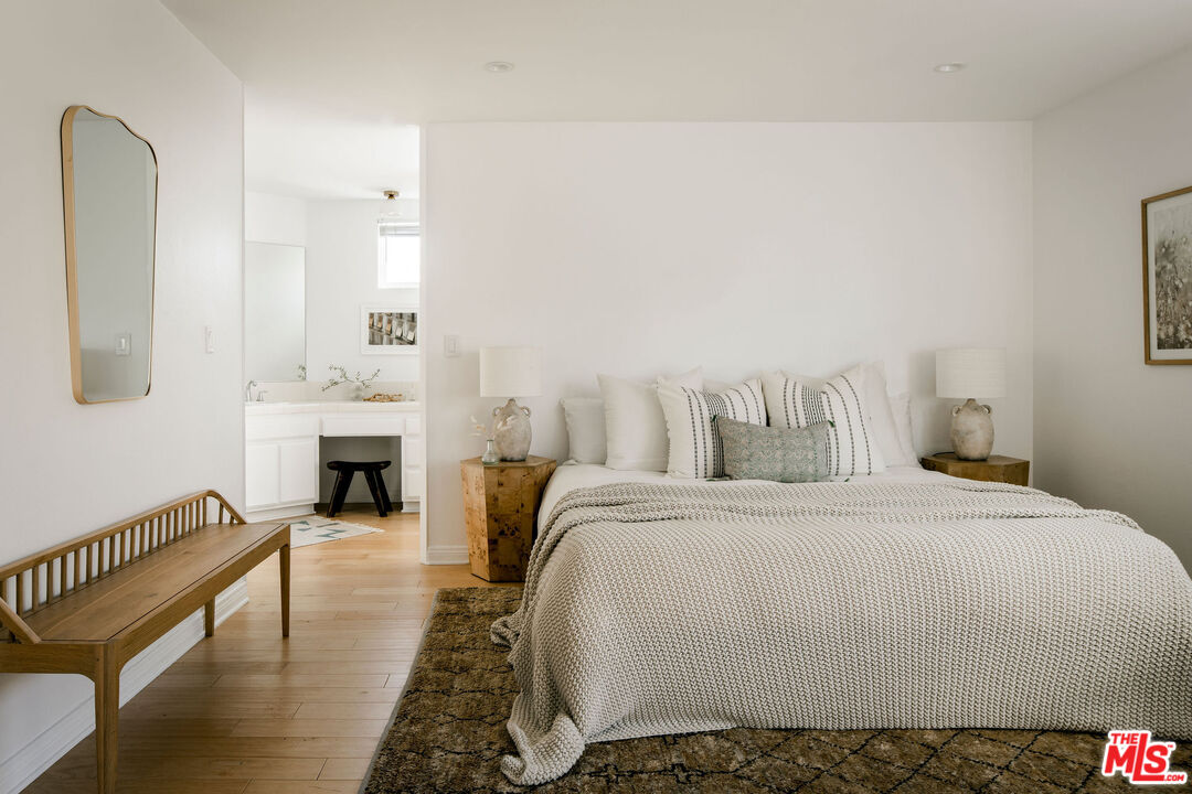 1014 9th Street, Unit 4 Santa Monica, CA 90403 - Photo 19 of 38 a spacious bedroom with a bed and a fireplace