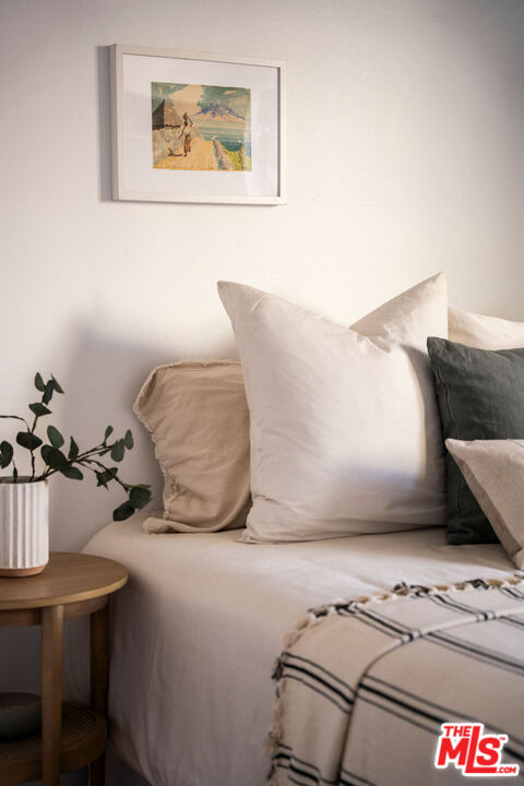 1014 9th Street, Unit 4 Santa Monica, CA 90403 - Photo 27 of 38 a bedroom with a bed and a couch