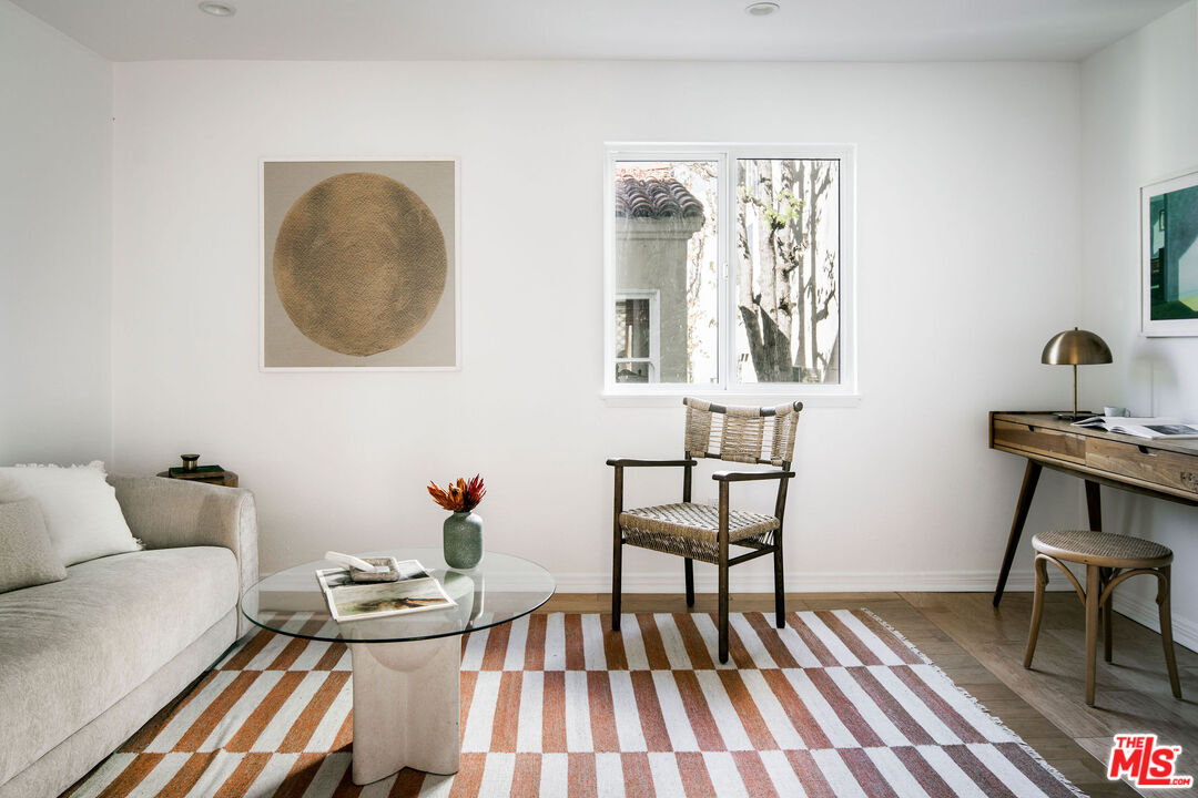 1014 9th Street, Unit 4 Santa Monica, CA 90403 - Photo 31 of 38 a living room with furniture and wooden floor