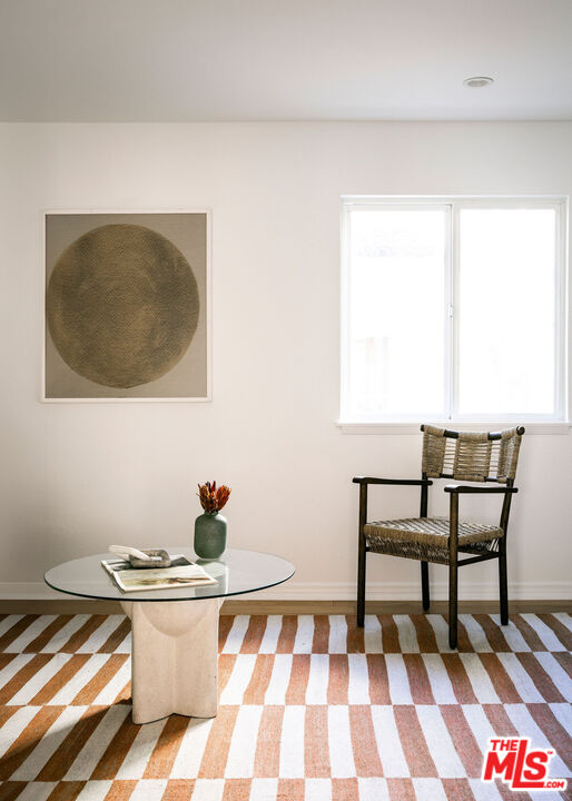1014 9th Street, Unit 4 Santa Monica, CA 90403 - Photo 34 of 38 a living room with a couch and a table
