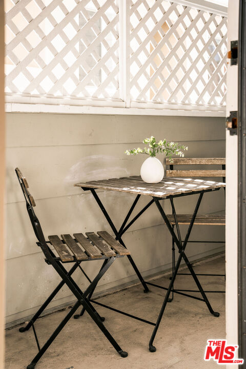 1014 9th Street, Unit 4 Santa Monica, CA 90403 - Photo 38 of 38 a backyard of a house with table and chairs