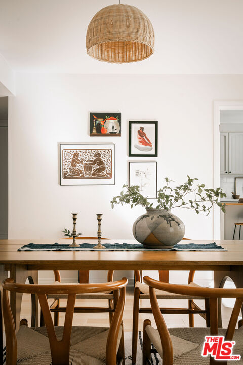1014 9th Street, Unit 4 Santa Monica, CA 90403 - Photo 4 of 38 a view of a dining room with furniture and wooden floor