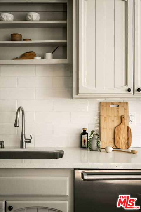 1014 9th Street, Unit 4 Santa Monica, CA 90403 - Photo 10 of 38 a kitchen with a sink and cabinets