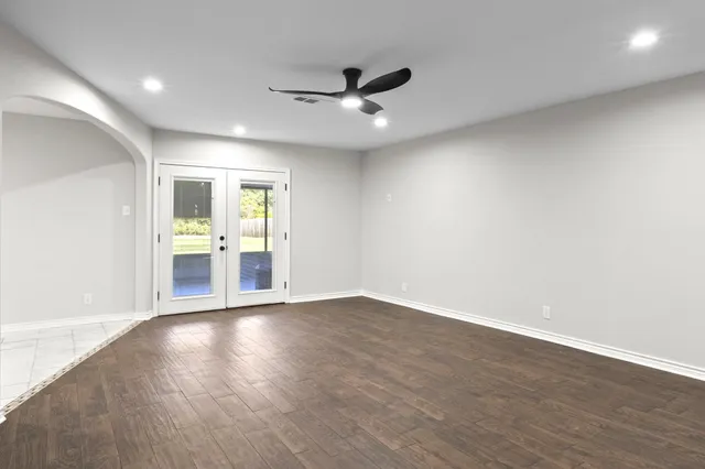 a kitchen with stainless steel appliances granite countertop a refrigerator a stove top oven a sink and dishwasher