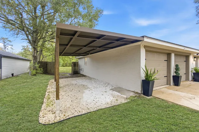 an empty room with mirror and a window