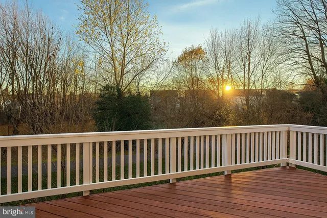 a view of wooden deck and trees