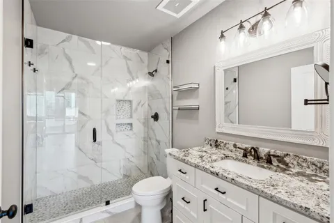 a view of walk in closet with wooden floor