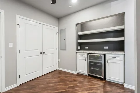a close view of a utility room with dryer and washer