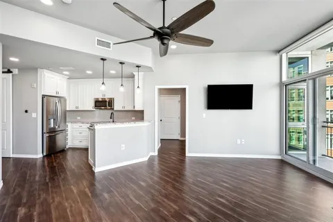 a view of a kitchen with wooden floor