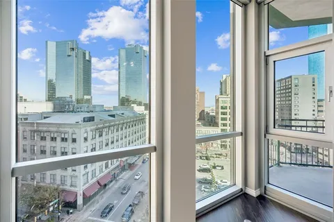 a view of an empty room with a flat screen tv