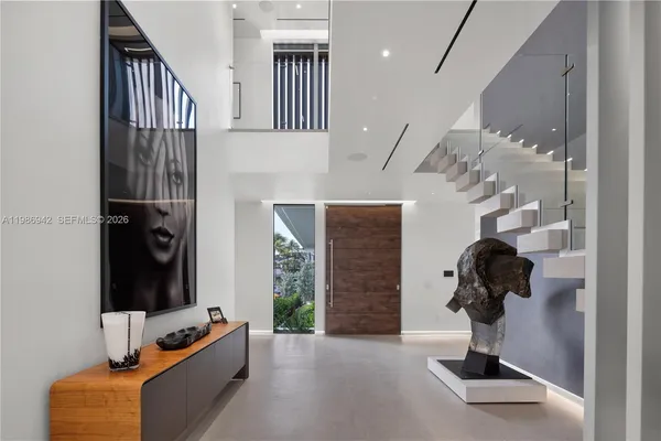 a view of hallway with livingroom and furniture