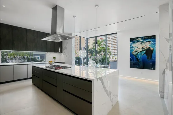 a kitchen with stainless steel appliances a sink and cabinets