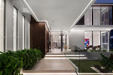 a view of a building with a potted plant and flower plants