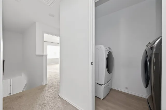 view of a room with door and refrigerator