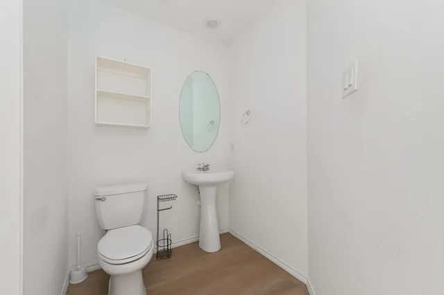 a bathroom with a toilet and a sink