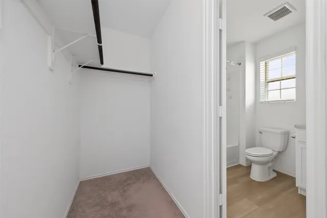 a bathroom with a toilet and a sink
