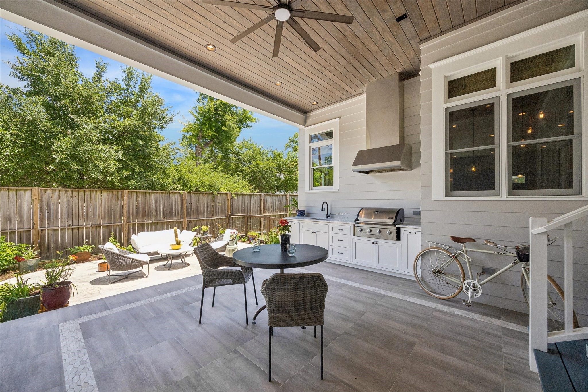 1101 Omar Street Houston, TX 77009 - Photo 35 of 46 Exceptional outdoor kitchen with brand-new countertops, built-in gas grill, and covered entertaining space overlooking the backyard and gated driveway — designed for effortless gatherings and year-round outdoor living.